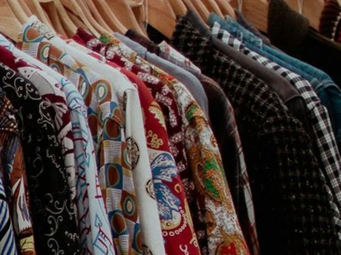 a car parked next to a bunch of clothes